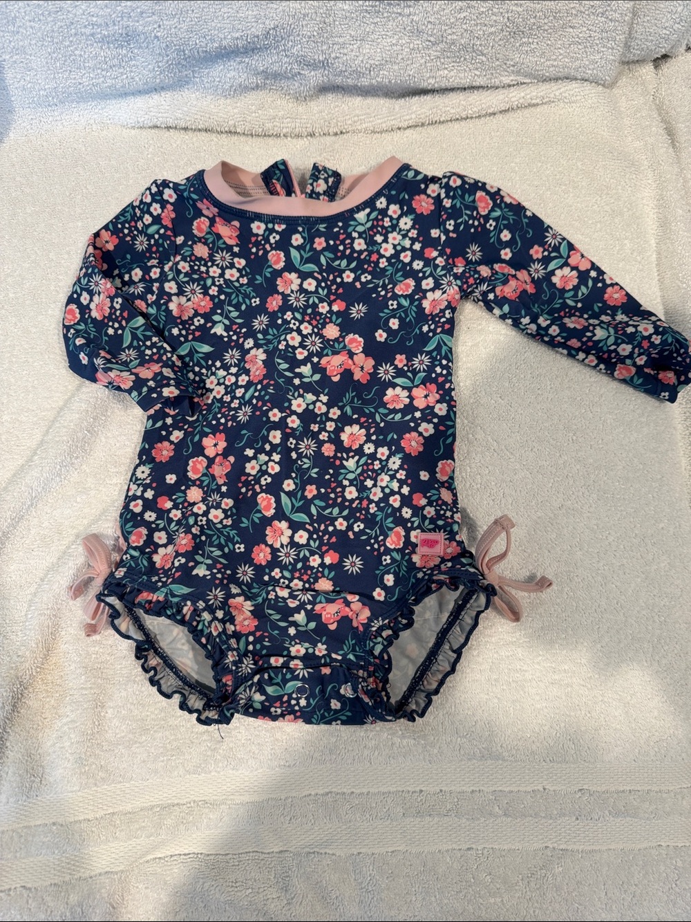 Ruffle Butts Navy Floral One-Piece Swimsuit with Pink Accents